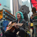 Lauren DiGioia of Occupy Wall Street croons in Times Square on May 15