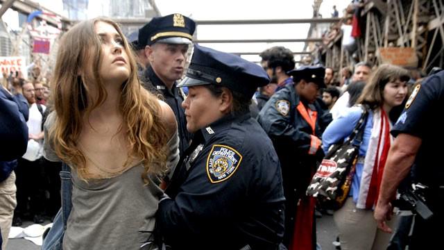 http://www.occupy.com/sites/default/files/styles/slide_narrow/public/field/image/occupy-wall-street-pretty-girl-arrested-article.jpg?itok=QSgi8NPJ
