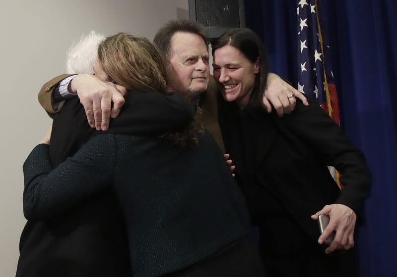 Edwin Hardeman and his wife, Mary, hug their attorneys at a postverdict press conference.