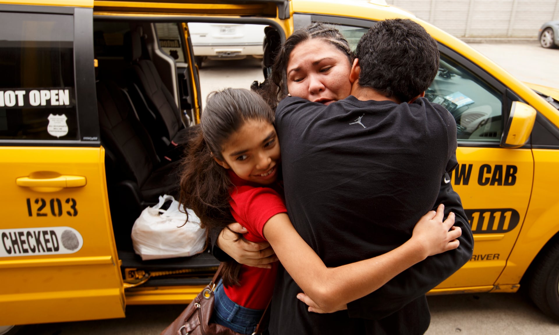 Silvana Bermudez hugs her children outside a bus station in Houston, Texas, on 16 March. She and her kids were caught by Ice and sent to separate facilities after leaving El Salvador. Photograph: The Washington Post/Getty Images