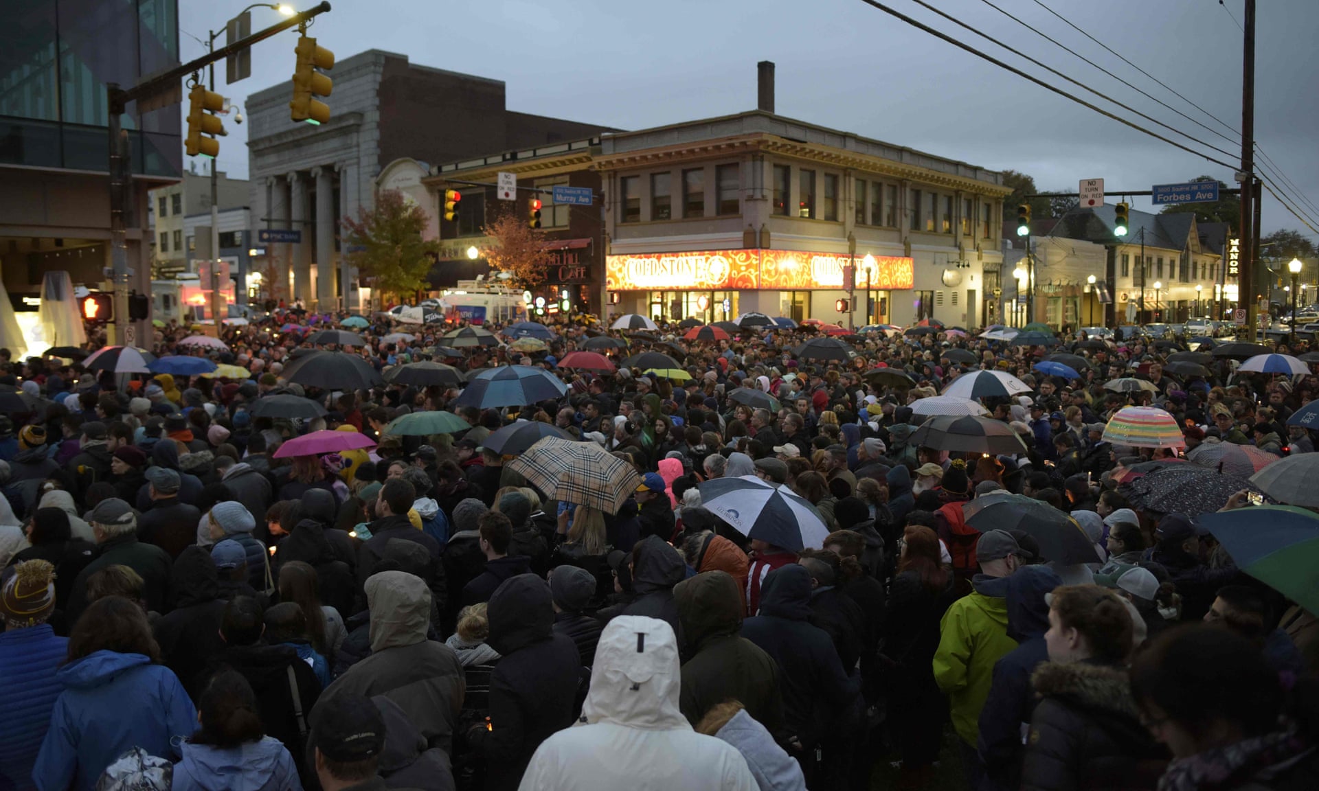 Members of the Squirrel Hill community come together for a student-organized candle-light vigil. Photograph: Dustin Franz/AFP/Getty Images