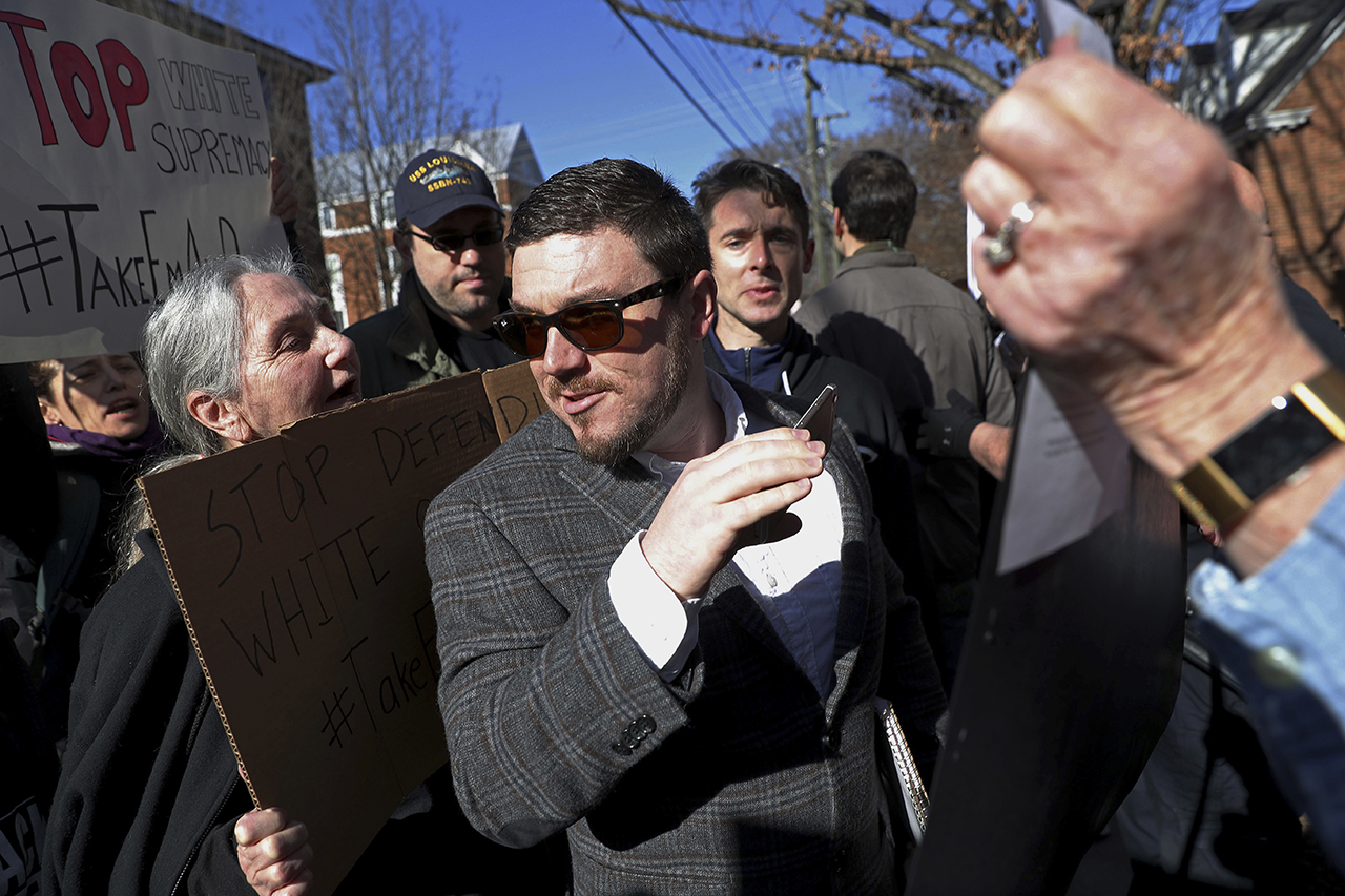 Jason Kessler walks through a crowd of protesters in front of the Charlottesville Circuit Courthouse on Feb. 27, 2018, ahead of a decision regarding the covered Confederate statues. Photo: Zack Wajsgras/The Daily Progress via AP