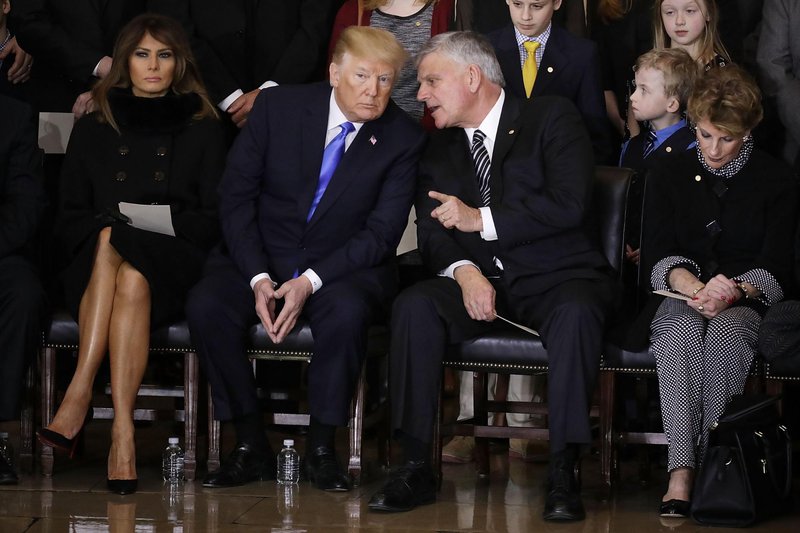 Melania Trump, Donald Trump, and Franklin Graham at his father Billy Graham’s funeral | Chip Somodevilla/DPA/PA Images. All rights reserved.