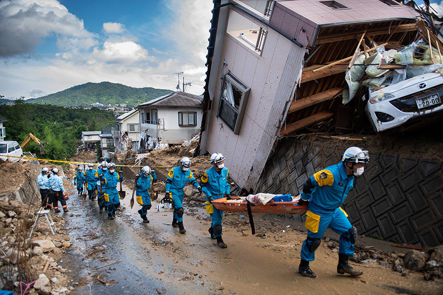 Extreme rainfall unleashed landslides and flooding that knocked homes off their foundations in Kumano, Japan. The storms and floods in early July were blamed for more than 200 deaths. Credit: Martin Bureau/AFP/Getty Images