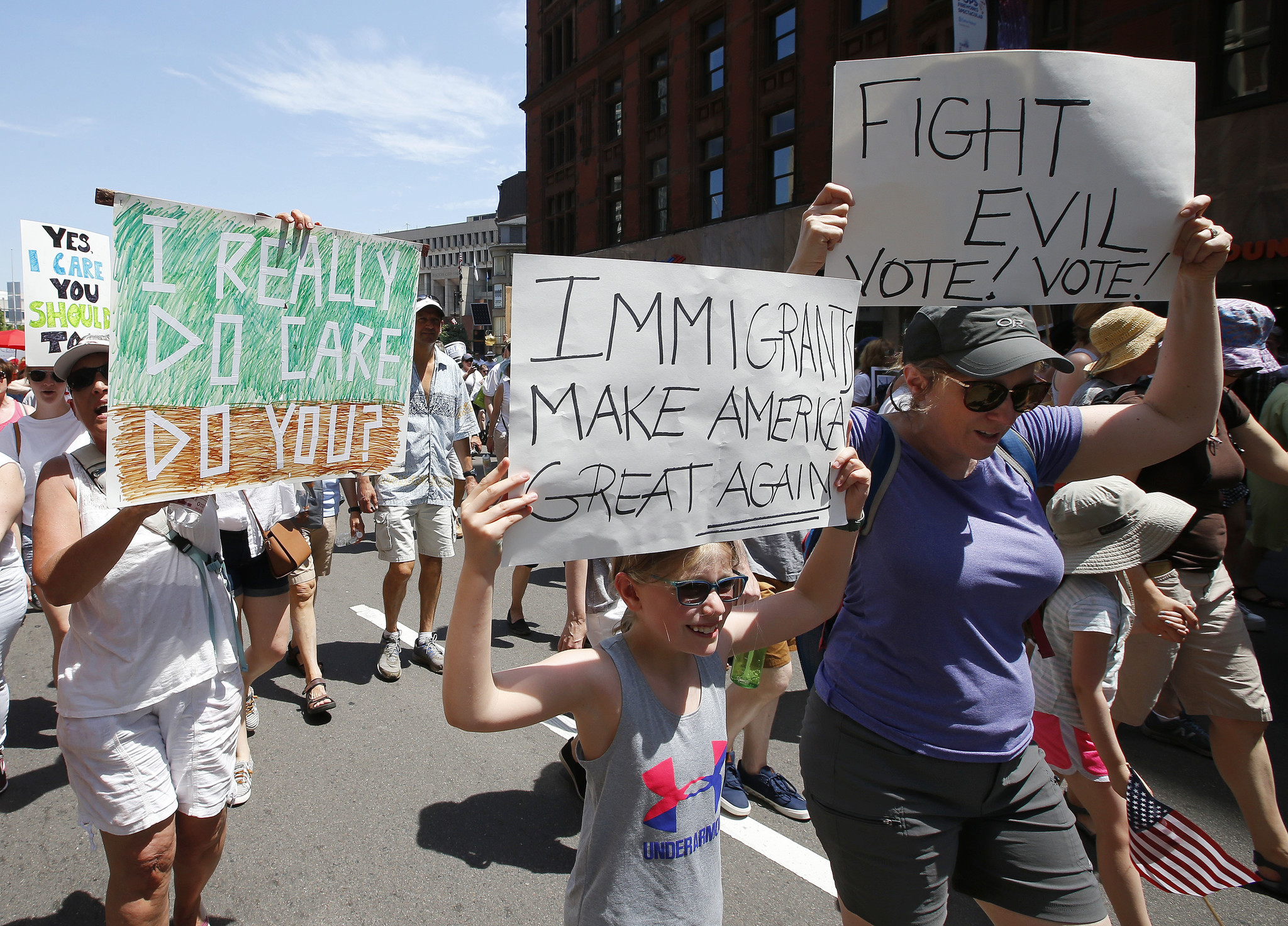 BOSTON: Sara Karp, center, of Acton, Mass., marches in a rally. Winslow Townson / Associated Press