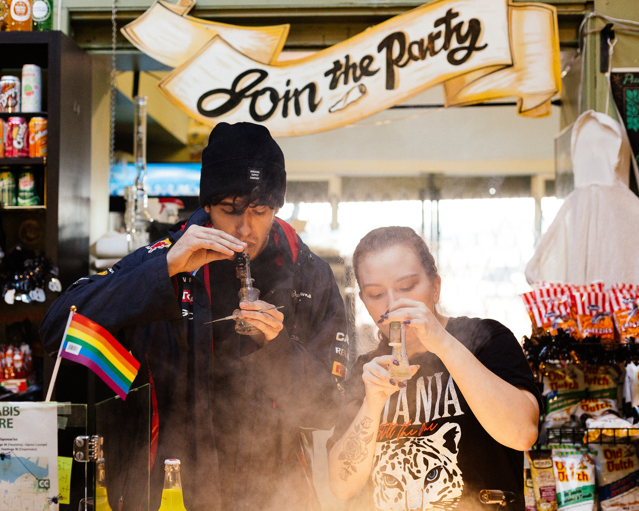 People smoking pot at a store in Vancouver, British Columbia. Licensed cannabis growers have been rushing for months to get a foothold in what is expected to be a $5 billion industry by 2020. Credit: Alana Paterson for The New York Times