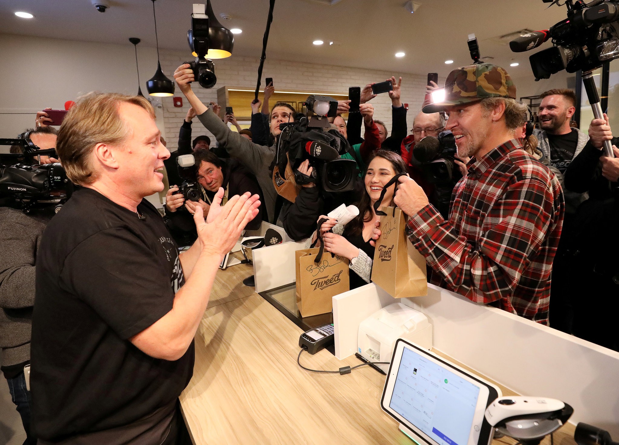 The first legal cannabis sale at Tweed, a retail store in St. John’s. Canada is only the second country in the world, after Uruguay, to legalize cannabis. Credit: Chris Wattie/Reuters