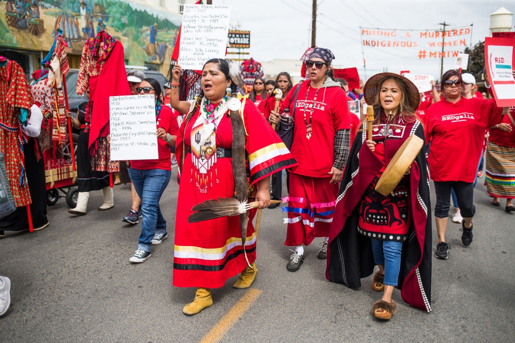 Roxanne White, center, leads a march through downtown Toppenish, Wash., wearing red to bring awareness to missing and murdered Indigenous women on May 5, 2018. Photo: Jake Parrish/Yakima Herald-Republic