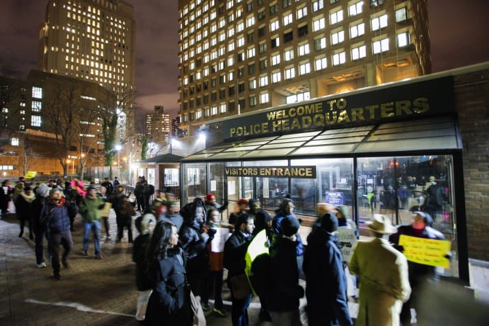 Demonstrators outside police headquarters call for action in response to police violence, Dec. 12, 2014. - Eduardo Munoz / Reuters