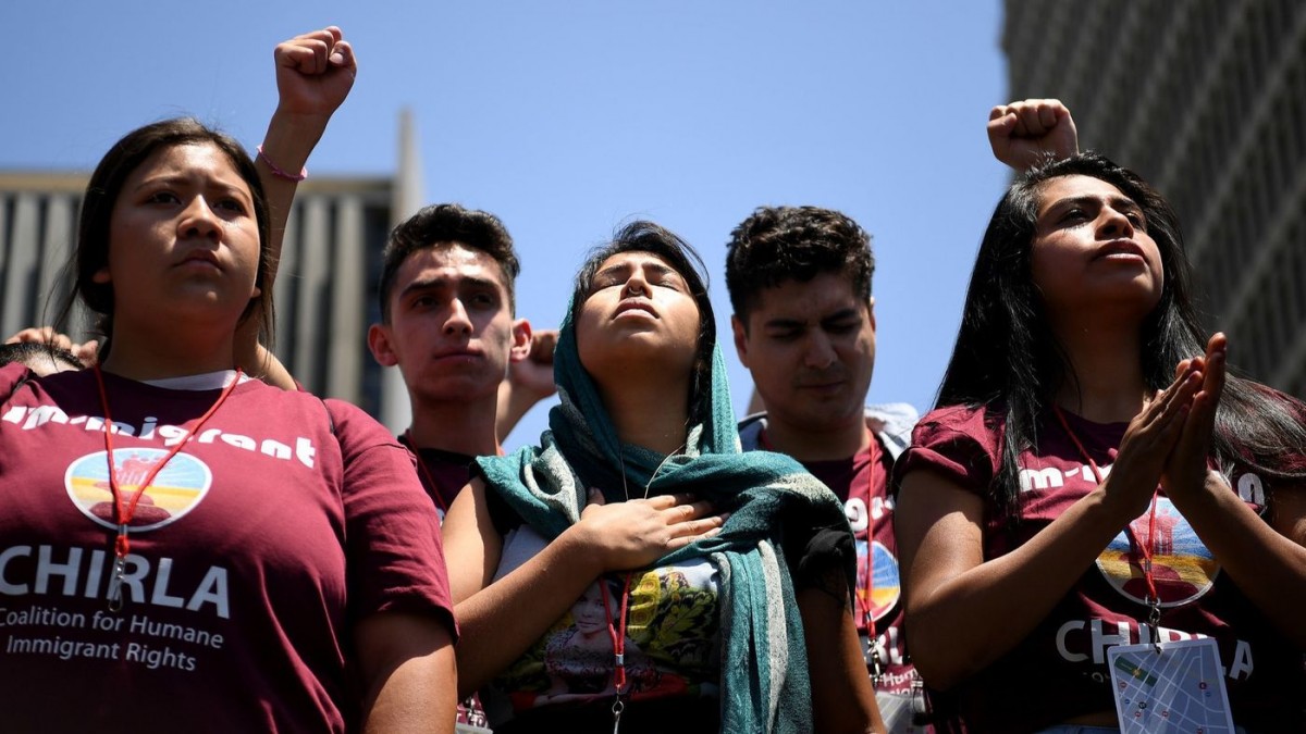 Protestors listen to speeches during a downtown L.A. rally against U.S. immigration policies. (Wally Skalij / Los Angeles Times)