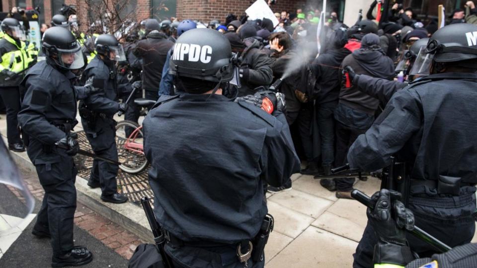 Police officers in Washington using pepper spray on protesters on Inauguration Day. Credit Zach Gibson/Agence France-Presse — Getty Images