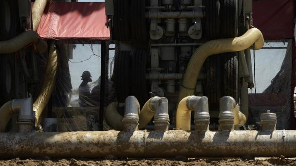 A fracking crew member works inside the Halliburton Sandcastle, at an Anadarko Petroleum Corporation site, near Brighton, May 19, 2014. (RJ Sangosti, The Denver Post)