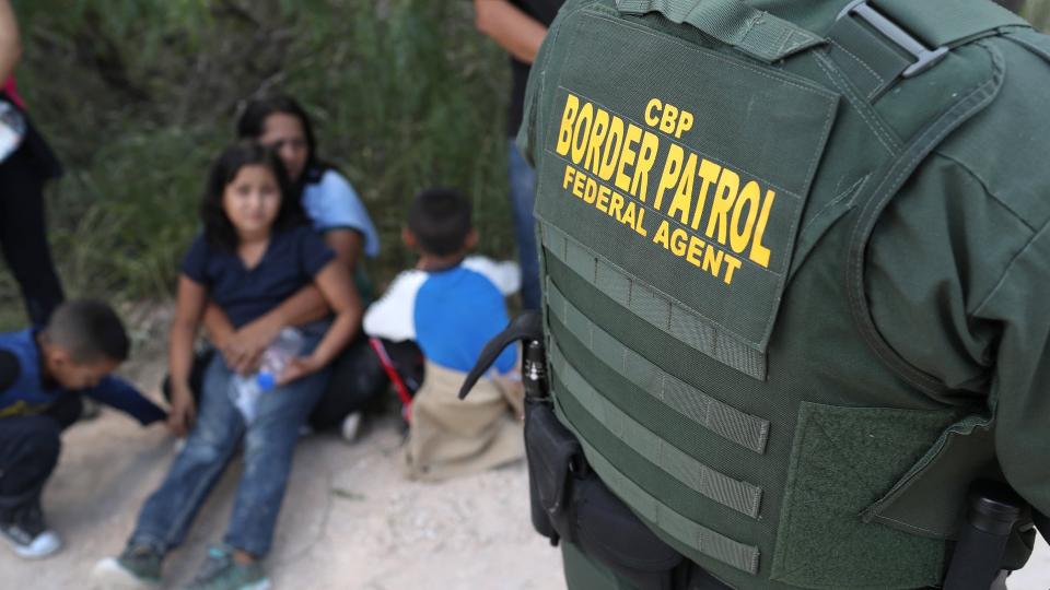 US Border Patrol agents take a family into custody near McAllen, Texas. Photograph: John Moore/Getty Images