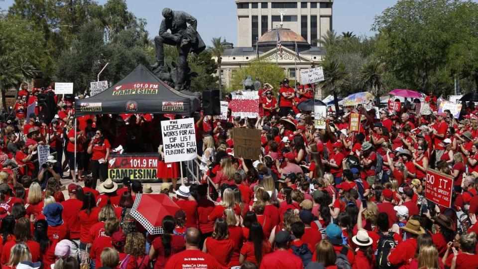 © The Associated Press With the Arizona Capitol in the background, thousands of teachers continue to protest Thursday, May 3, 2018, in Phoenix. After an all night legislative budget session the legislature passed the new education spending portion of the 