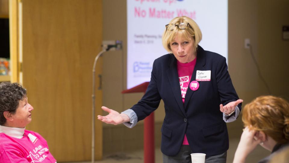 Cathy Glasson, a nurse running for Iowa governor, chats with attendees of a Planned Parenthood training in Des Moines on march 6. (Eva Lewin)