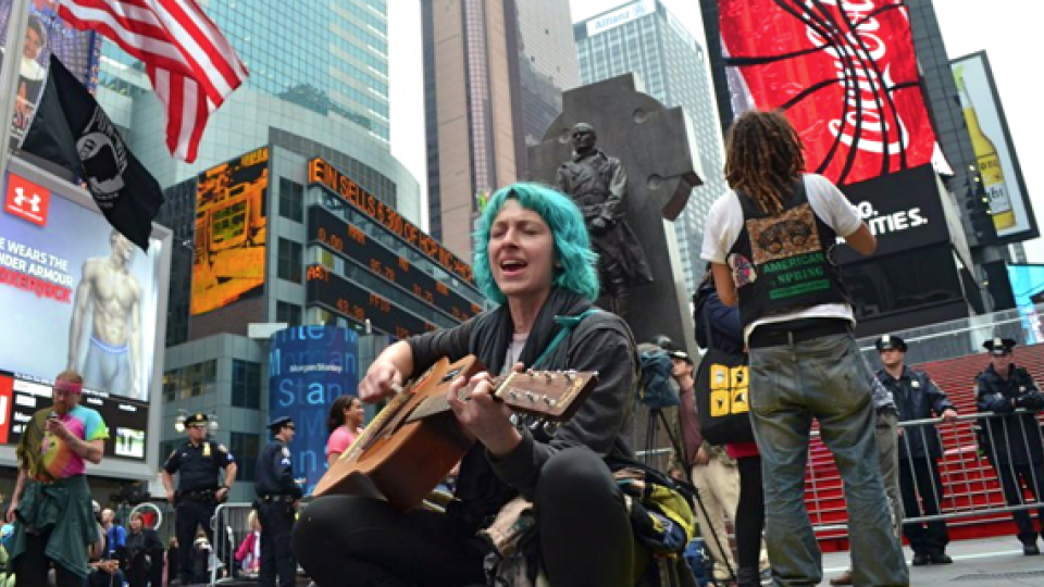 Lauren DiGioia of Occupy Wall Street croons in Times Square on May 15
