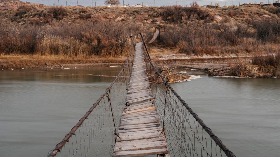A footbridge in San Juan County, Utah, damaged in spring floods and never fixed. Alicia Coggeshell, 52, who lives in the southern part of the county, said the bridge was so dilapidated that her neighbors sometimes fall into the icy water. 